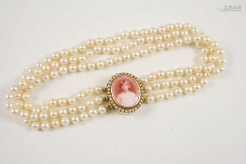 A THREE ROW UNIFORM CULTURE PEARL CHOKER the pearls measure approximately 6.3mm. and are set to an