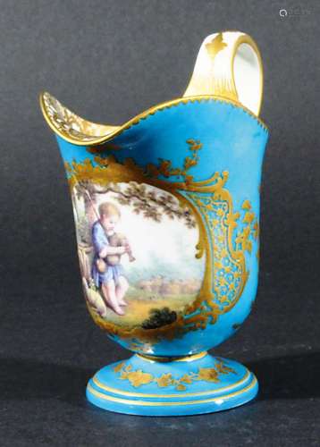 SEVRES HELMET FORM CREAM JUG, probably late 18th century, painted with a shepherd boy playing