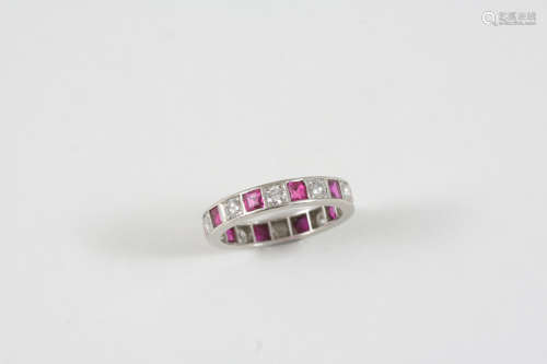 A RUBY AND DIAMOND FULL CIRCLE ETERNITY RING alternately set with circular-cut diamonds and square-