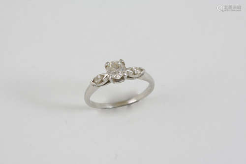 A DIAMOND SOLITAIRE RING the old brilliant-cut diamond is set with marquise-cut diamond to each