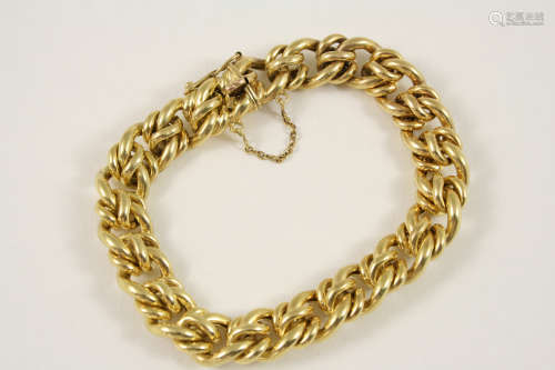 A 15CT. GOLD DOUBLE CURB LINK BRACELET with concealed clasp, 19cm. long, 27 grams.