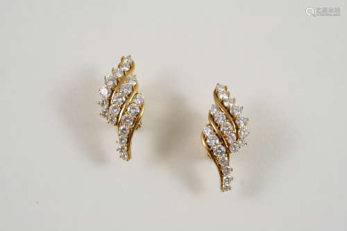A PAIR OF DIAMOND EARRINGS each formed with three rows of graduated brilliant-cut diamonds, in 18ct.
