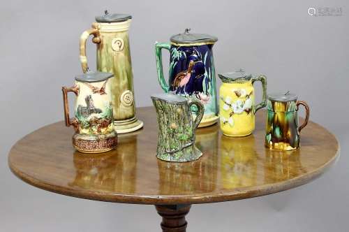 COLLECTION OF MAJOLICA STYLE JUGS, 19th century, to include a relief moulded farmyard scene,