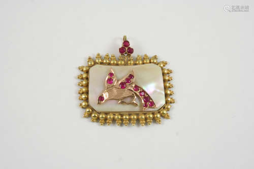 A RUBY AND MOTHER-OF-PEARL PENDANT the central mother-of-pearl panel is mounted with a gold bird