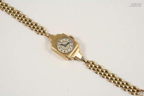 A LADY'S 9CT. GOLD WRISTWATCH the circular dial with Arabic numerals, on a gold bracelet with ladder