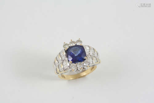 A SYNTHETIC SAPPHIRE AND DIAMOND CLUSTER RING the rounded square-shaped synthetic sapphire is set