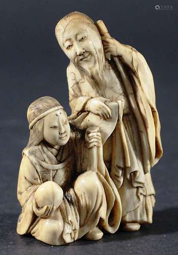 JAPANESE IVORY NETSUKE, of Shoulau and Guanyin, signature to base, height 6.5cm