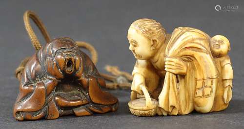 JAPANESE IVORY NETSUKE, carved as a mother and child, she carrying a sack and basket; and another