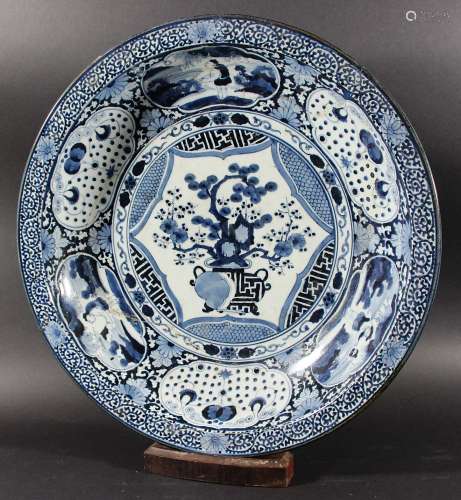 LARGE JAPANESE BLUE AND WHITE CHARGER, 19th century, with Chinese style central bonsai in a vase