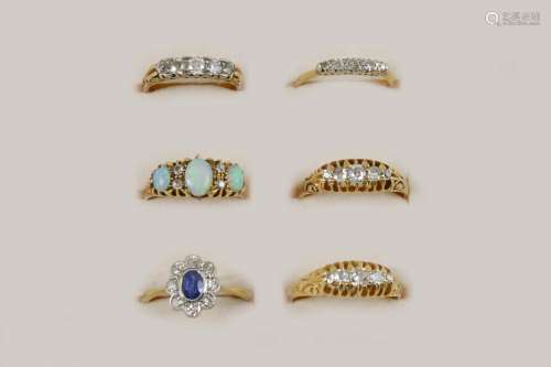 SIX ASSORTED GEM SET AND GOLD RINGS including a sapphire and diamond cluster ring, set in 18ct. gold
