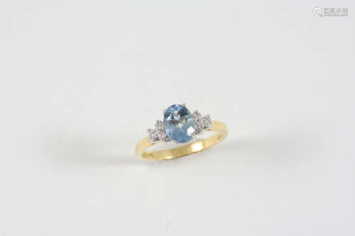 AN AQUAMARINE AND DIAMOND RING the oval-shaped aquamarine is set with three circular-cut diamonds to