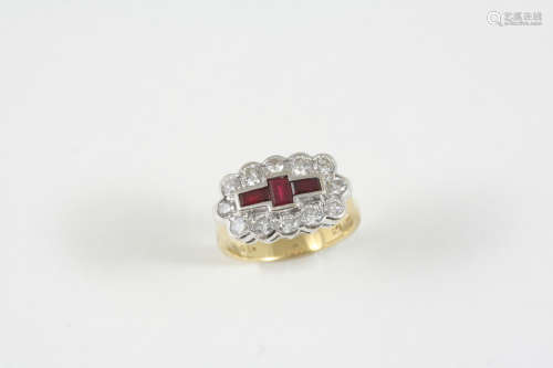 A RUBY AND DIAMOND CLUSTER RING the three rectangular-shaped rubies are set within a surround of