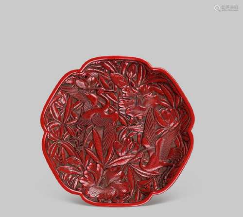 A CARVED RED LACQUER BRACKET-LOBED DISH, 18TH CENTURY