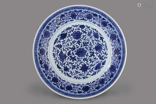 A MAGNIFICENT LARGE IMPERIAL BLUE AND WHITE ‘SCROLLING LOTUS' DISH QIANLONG SEAL MARK IN UNDERGLAZE BLUE AND OF THE PERIOD