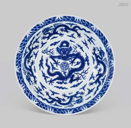 A RARE AND LARGE IMPERIAL BLUE AND WHITE 'DRAGON' DISH QIANLONG SEAL MARK IN UNDERGLAZE BLUE AND OF THE PERIOD