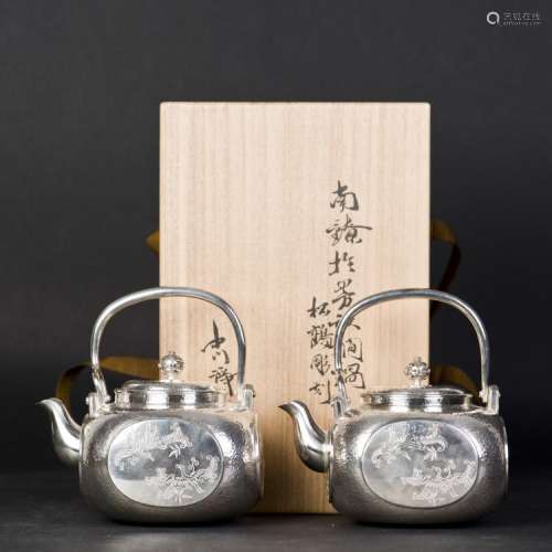 A PAIR OF ARCHAISTIC JAPANESE SILVER TEAPOTS