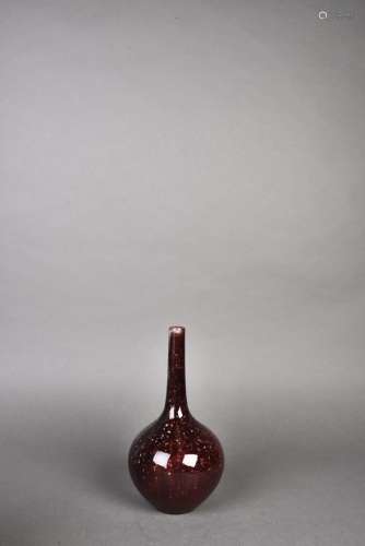 A 20TH CENTURY RED GLAZED BOTTLE VASE