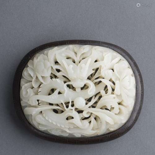 A WHITE JADE OPENWORK ‘DRAGON’ PLAQUE, 17TH CENTURY