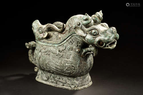 ARCHAIC BRONZE CAST 'MYTHICAL BEAST' RITUAL VESSEL, GUANG