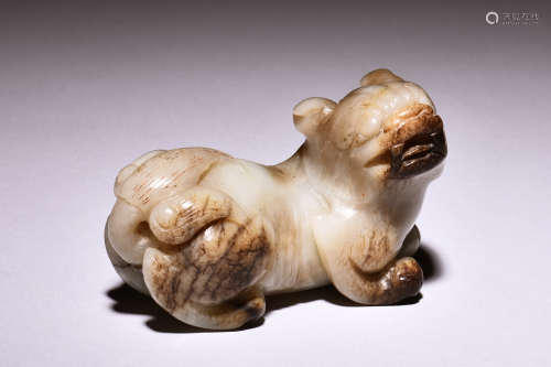 A WHITE JADE CARVED MYTHICAL LION FIGURE