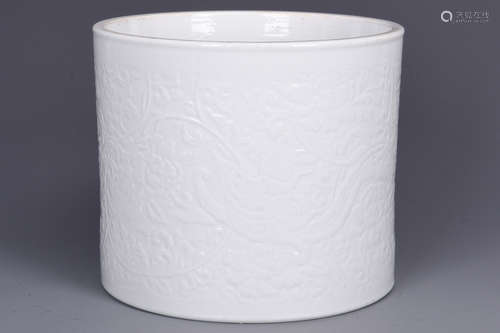 WHITE GLAZED AND CARVED 'DRAGON' BRUSH POT