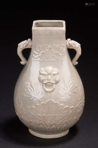 WHITE GLAZED AND CARVED 'LIONS' VASE