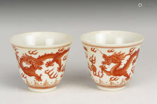 PAIR OF UNDERGLAZED RED 'DRAGONS' CUPS