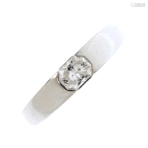 A platinum diamond single-stone ring. The octagonal-shape diamond, with tapered band. Estimated