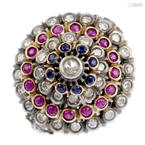 A diamond, ruby and sapphire dress ring. The single-cut diamond, within an alternating circular-