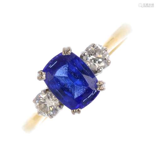 An 18ct gold tanzanite and diamond three-stone ring.