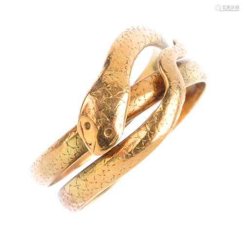 A gentleman's snake ring. Designed as a coiled textured snake, with dimpled eyes. Ring size Y1/2.