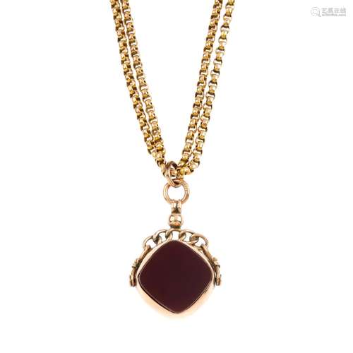 An Edwardian 9ct gold hardstone swivel fob, with longuard chain. The cushion-shape carnelian and