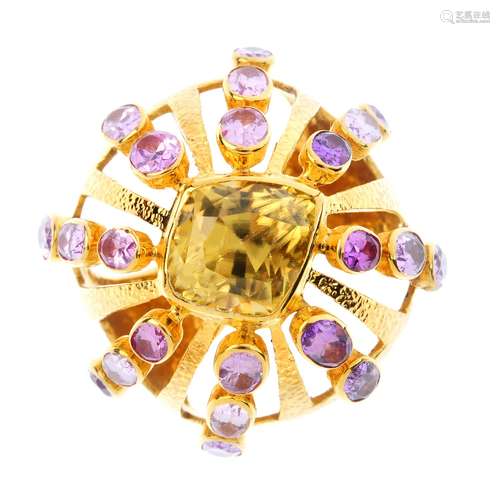 A zircon and sapphire cluster ring. Of openwork bombe design, the kite-shape yellow zircon, with