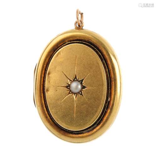 A late Victorian gold split pearl locket. Of oval outline, the star-set split pearl, with rope-twist