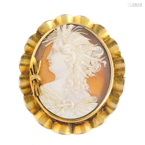 A mid Victorian 15ct gold shell cameo brooch. Carved to depcict Demeter in profile, with