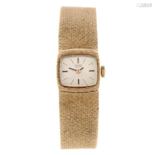 RECORD - a lady's 9ct gold bracelet watch. Case numbered 313210. Signed manual wind calibre 2111.
