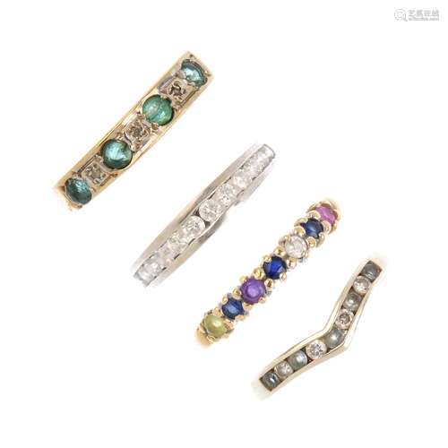 Four 9ct gold gem-set rings. To include a brilliant-cut diamond half eternity ring, an emerald and