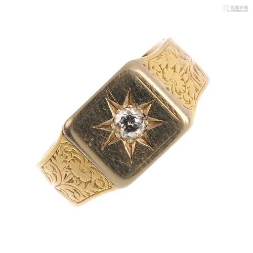 An 18ct gold diamond signet ring. The brilliant-cut diamond, within a star setting and engraved