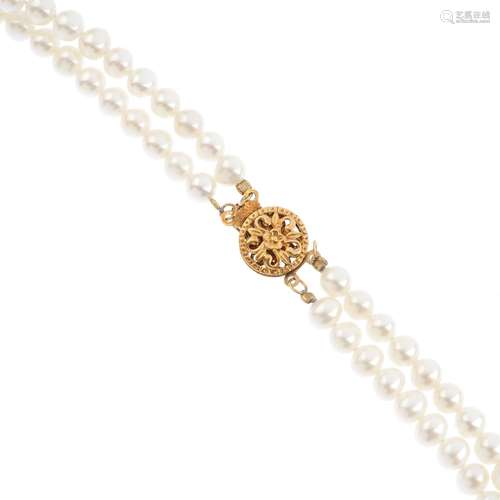 Three cultured pearl two-row necklaces. One with a 9ct gold single-cut diamond accent openwork