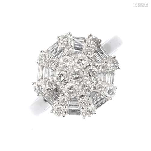 An 18ct gold diamond cluster ring. Of octagonal-outline, the vari-cut diamond cluster to the plain