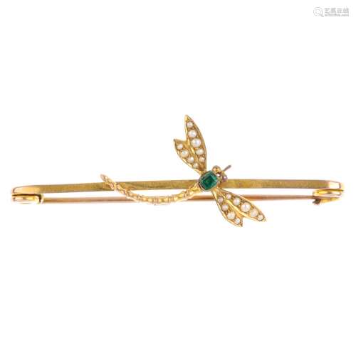 An early 20th century emerald and split pearl bar brooch. Designed as a dragonfly, with