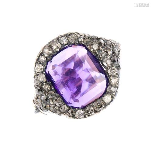 An amethyst and diamond dress ring. The rectangular-shape amethyst, with single-cut diamond surround