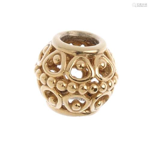 PANDORA - a charm. Designed as a gilded cage charm, with bead detail. Length 0.9cm. Weight 2gms.