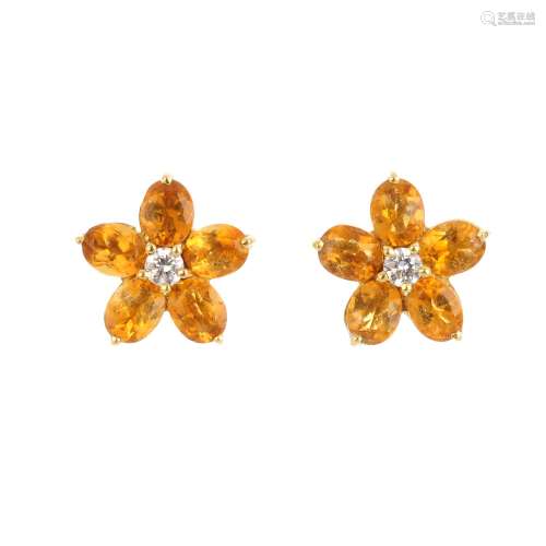A pair of citrine and diamond cluster earrings. Each designed as a brilliant-cut diamond, with