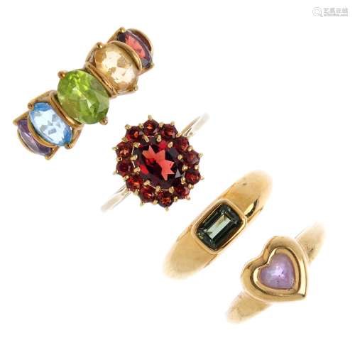 Four 9ct gold gem-set rings. To include a green tourmaline single-stone ring, a garnet cluster ring,