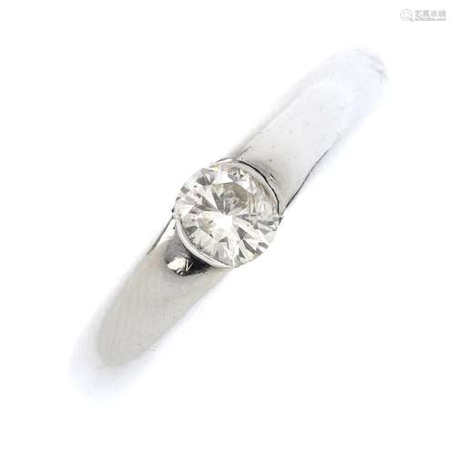 An 18ct gold diamond single-stone ring. The brilliant-cut diamond, inset to the tapered band.