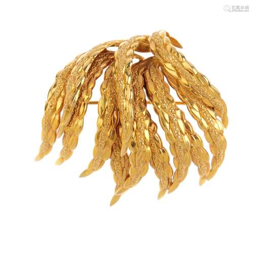 A 1960's 9ct gold foliate brooch. Designed as a foliate spray, with textured scrolling leaves.