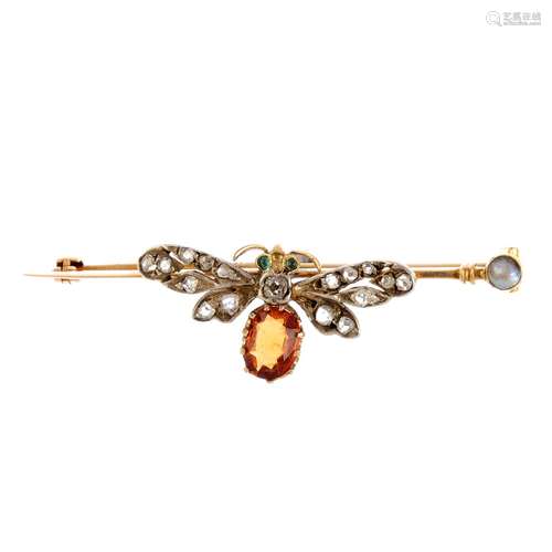 A gem-set insect bar brooch. Designed as a winged insect, with circular emerald cabochon eyes, old-