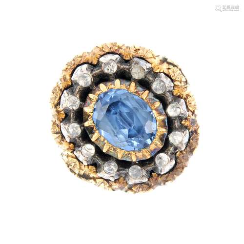 A gem-set dress ring. The foil-backed synthetic blue spinel, within a foil-backed rose-cut