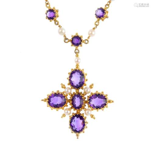 An amethyst and cultured pearl cross pendant. Designed as an oval-shape amethyst cross, with